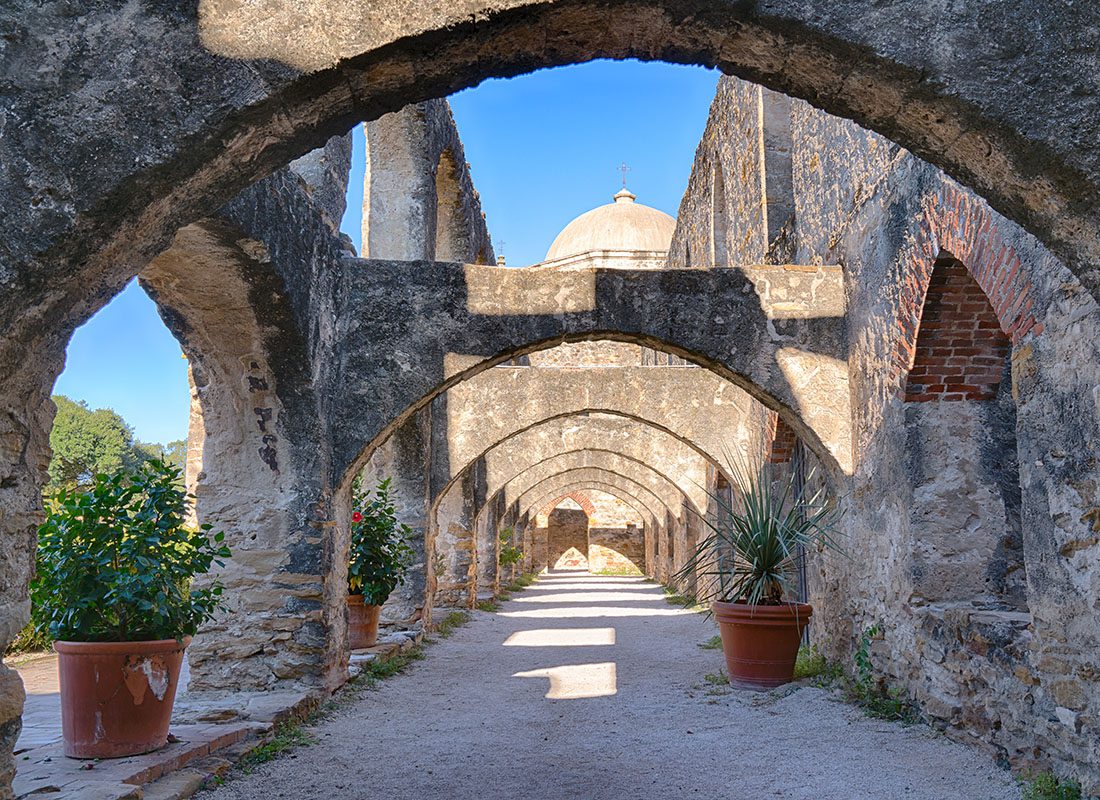 San Antonio, TX - Archways at the Mission in San Antonio Texas on a Bright Sunny Day
